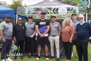 Windaan Team Photo With Greg Inglis Infront Of Windaan Branded Marquee
