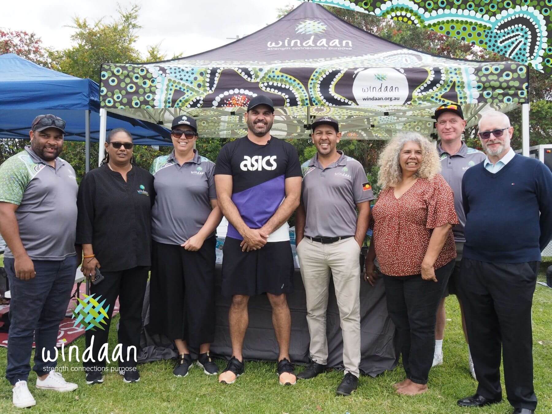 Windaan team photo with Greg Inglis infront of Windaan branded marquee